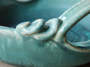 Close up of Handmade stoneware serving bowl with layered glaze finish