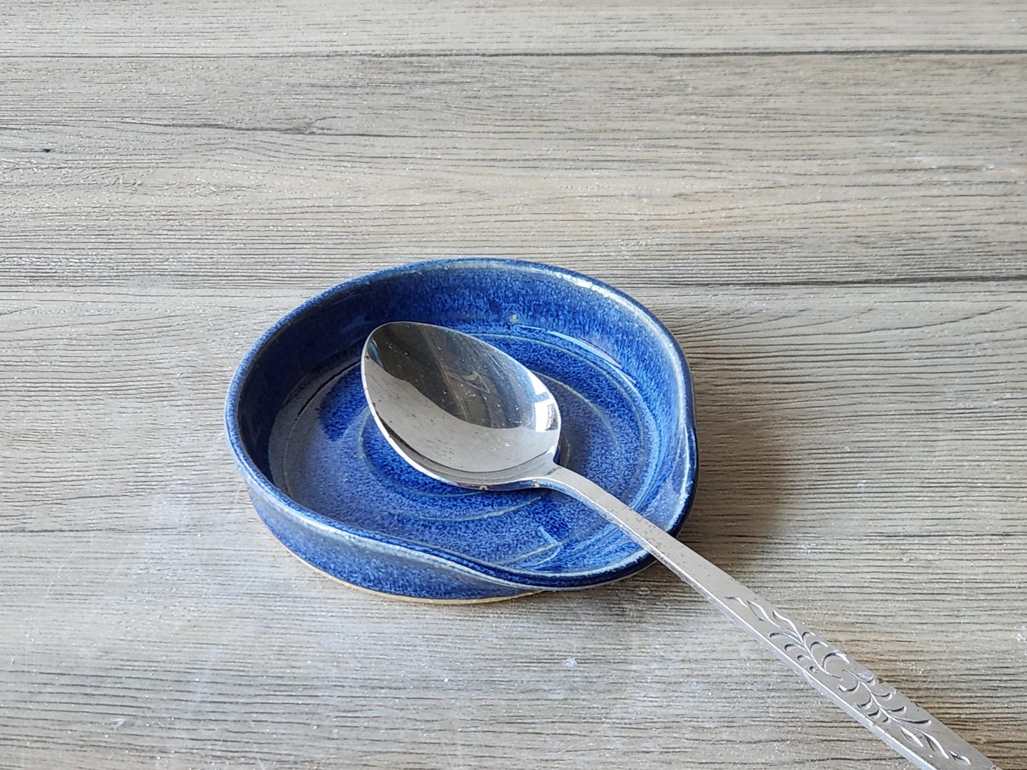 Pottery spoon rest on wooden counter – handmade in Melbourne