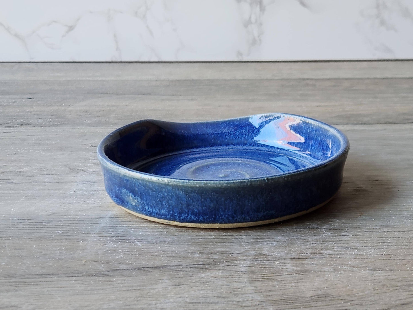 Mid blue ceramic kitchenware – artisan pottery spoon rest shown from the back