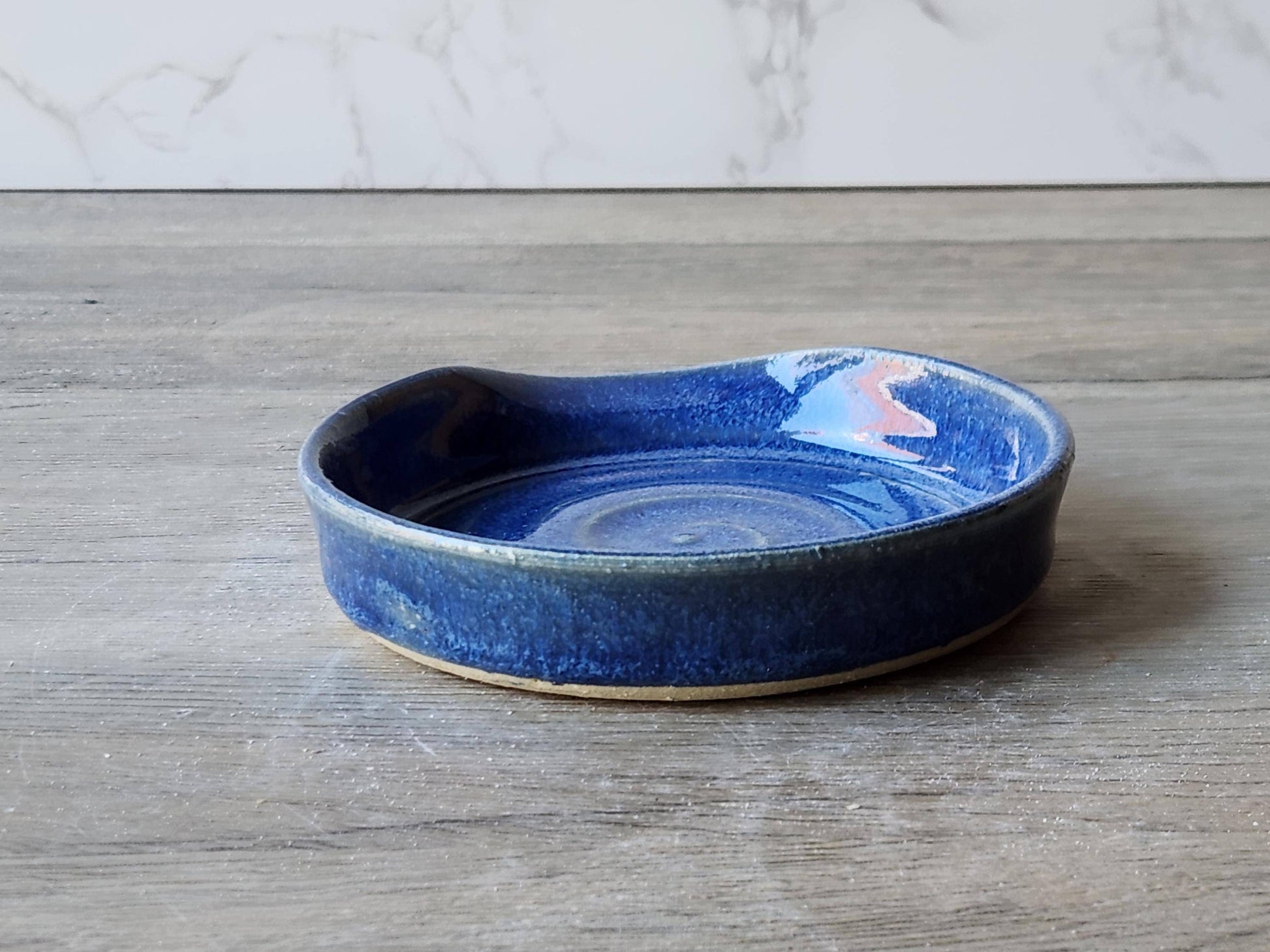 Mid blue ceramic kitchenware – artisan pottery spoon rest shown from the back