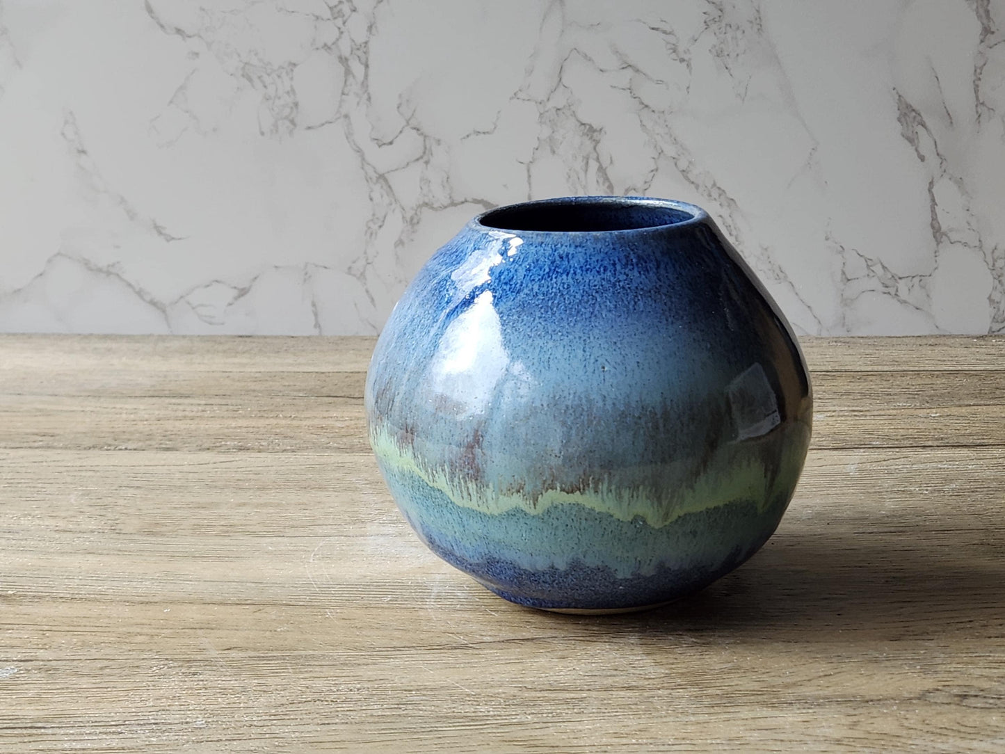 Artisan moon jar with glossy blue and green brown mottled glaze finish