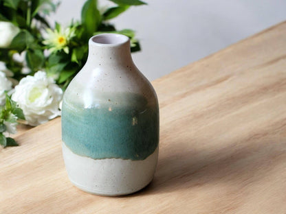 Handmade pottery bud vase in cream and green glaze