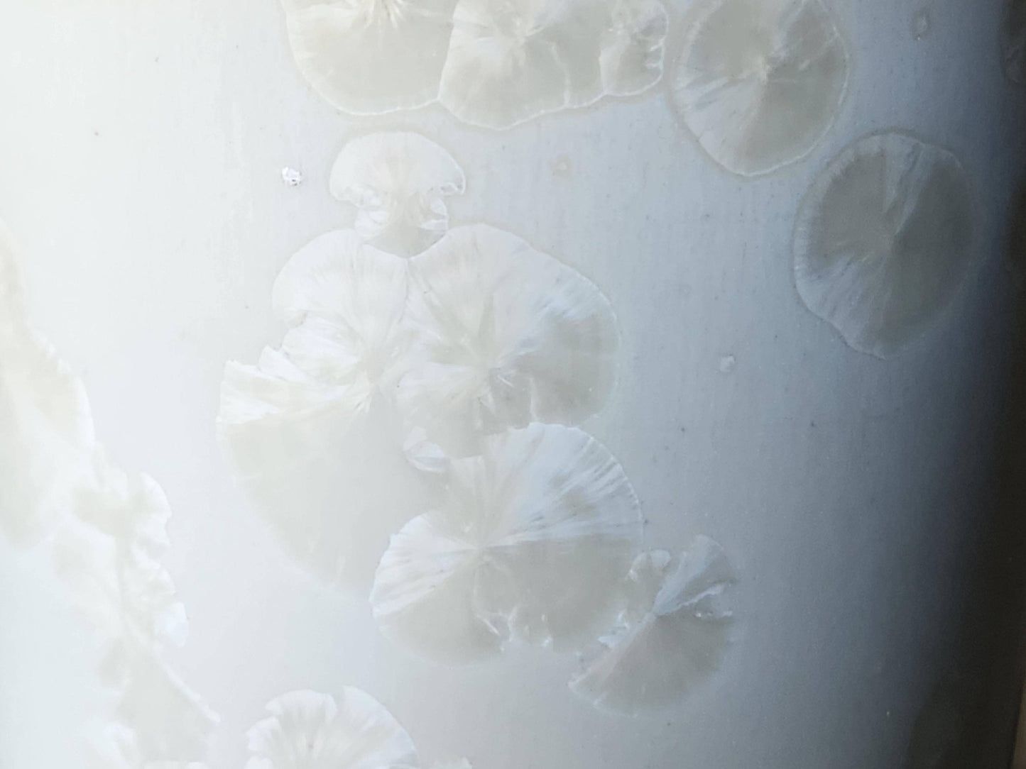Close up of crystals on One-of-a-kind crystalline glaze vase