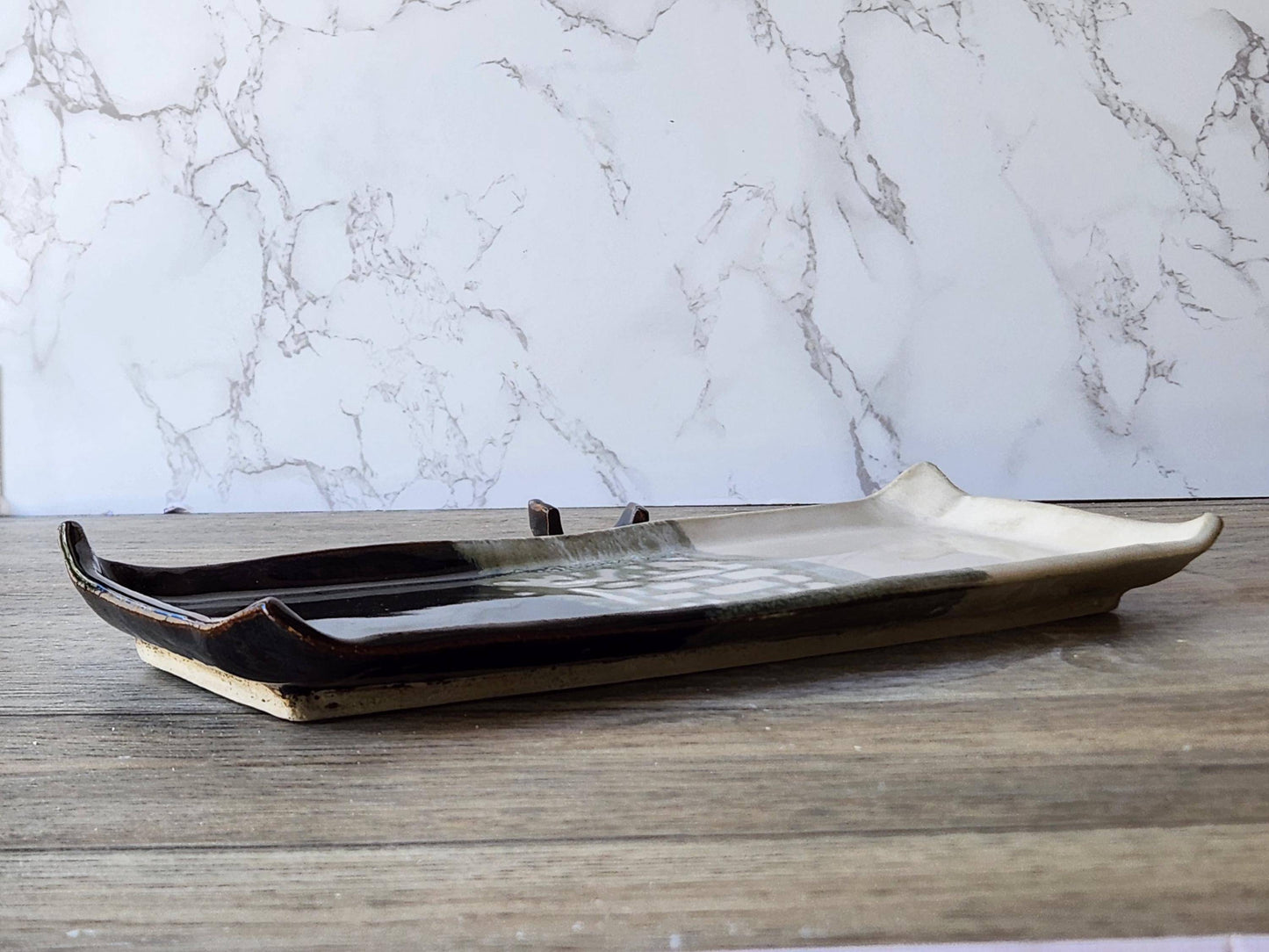 Elegant handmade ceramic sushi plate with chopstick rest
