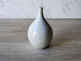 White crystalline pottery bud vase for a single flower display