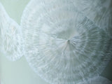 Close up of glaze showing rings of flower like crystals on a  Handmade Australian crystalline cylinder vase – soft green and white