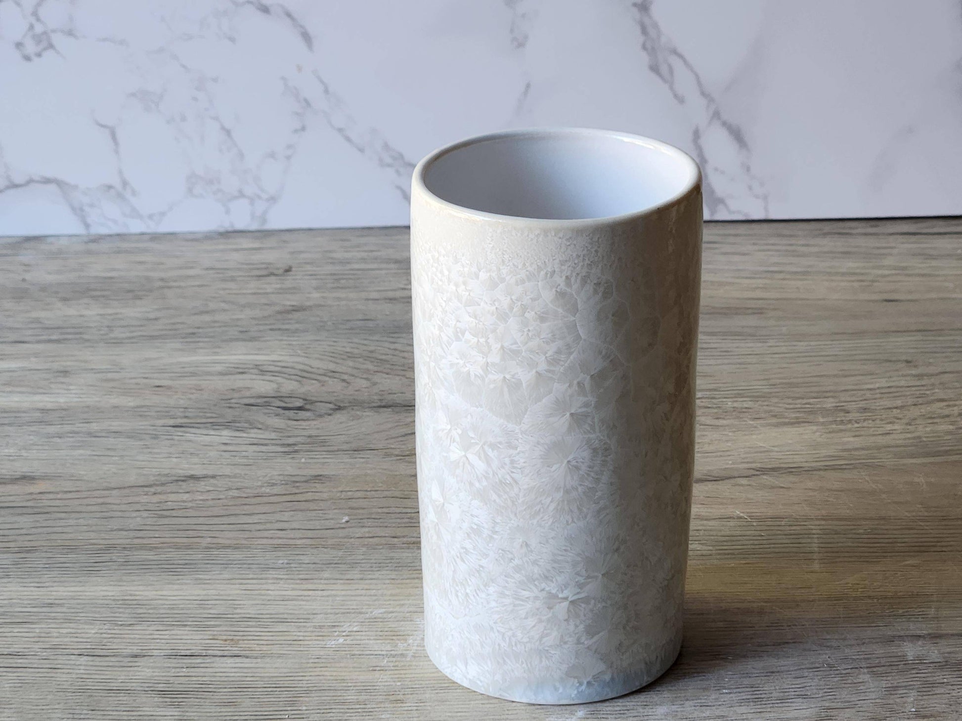 Handmade pottery tumbler with white crystalline glaze