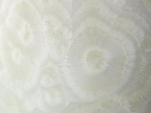 Close up of glaze on a Porcelain crystalline bud vase with lace-like glaze