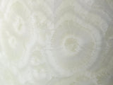 Close up of glaze on a Porcelain crystalline bud vase with lace-like glaze
