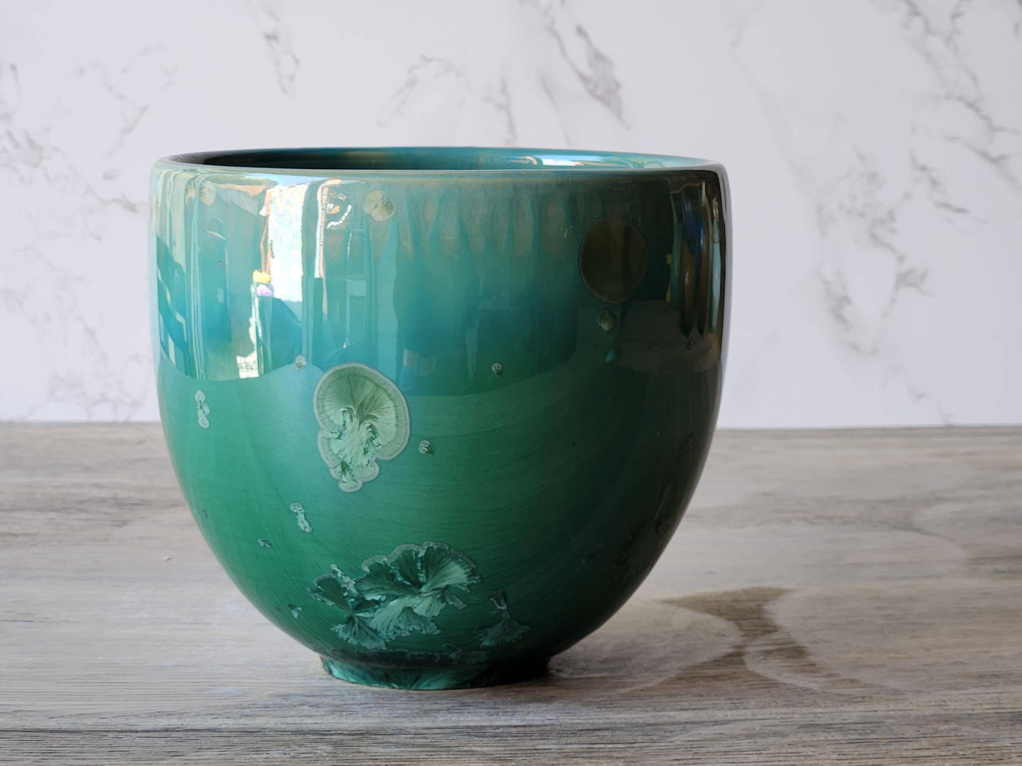 Handmade porcelain bowl with soft green crystalline finish