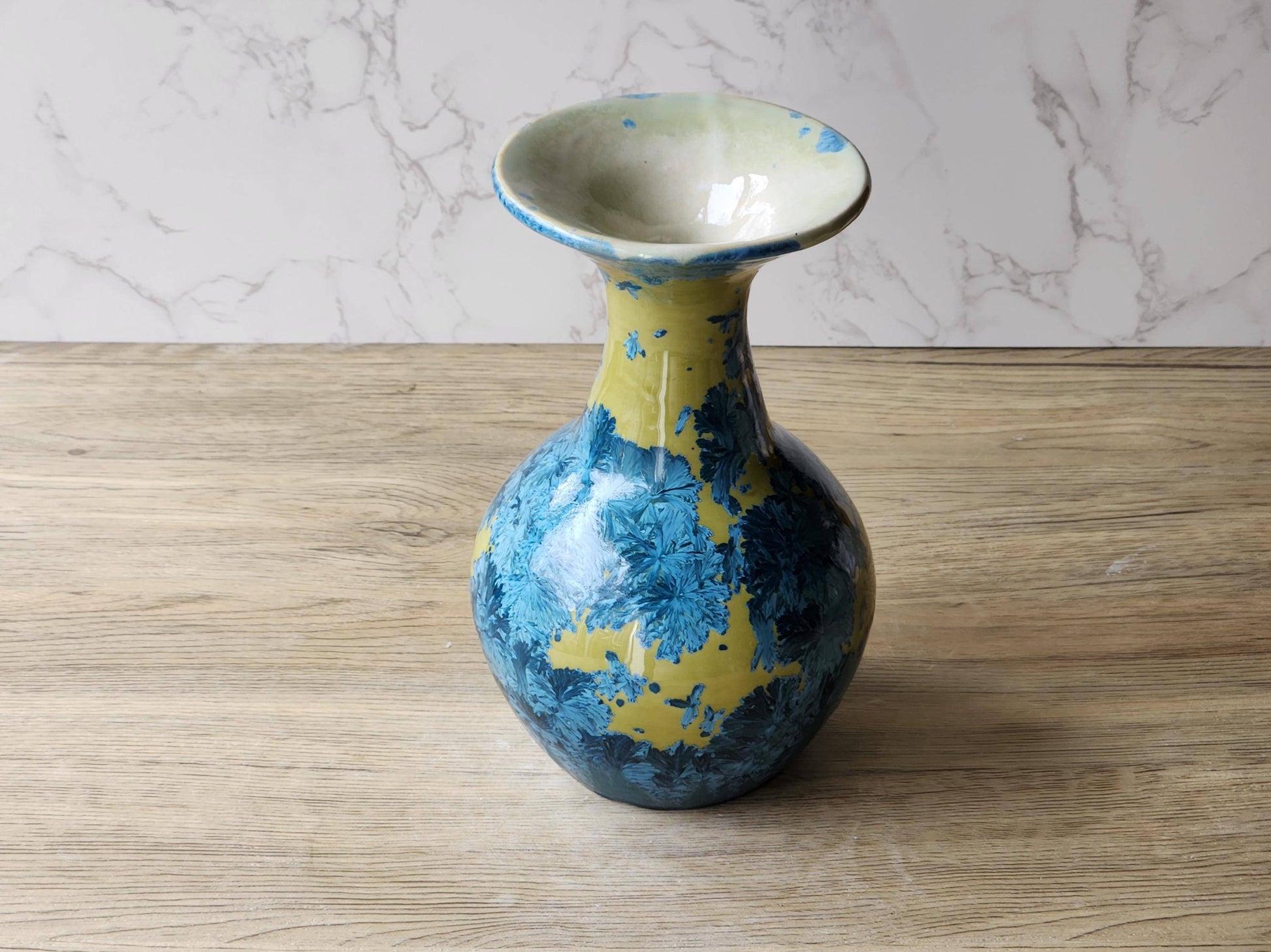 Blue crystal bloom design on mustard porcelain vase – artisan ceramics