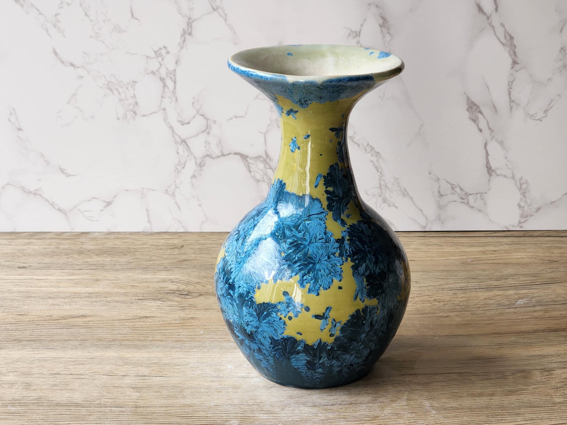 One-of-a-kind porcelain vase featuring blue crystals on mustard base
