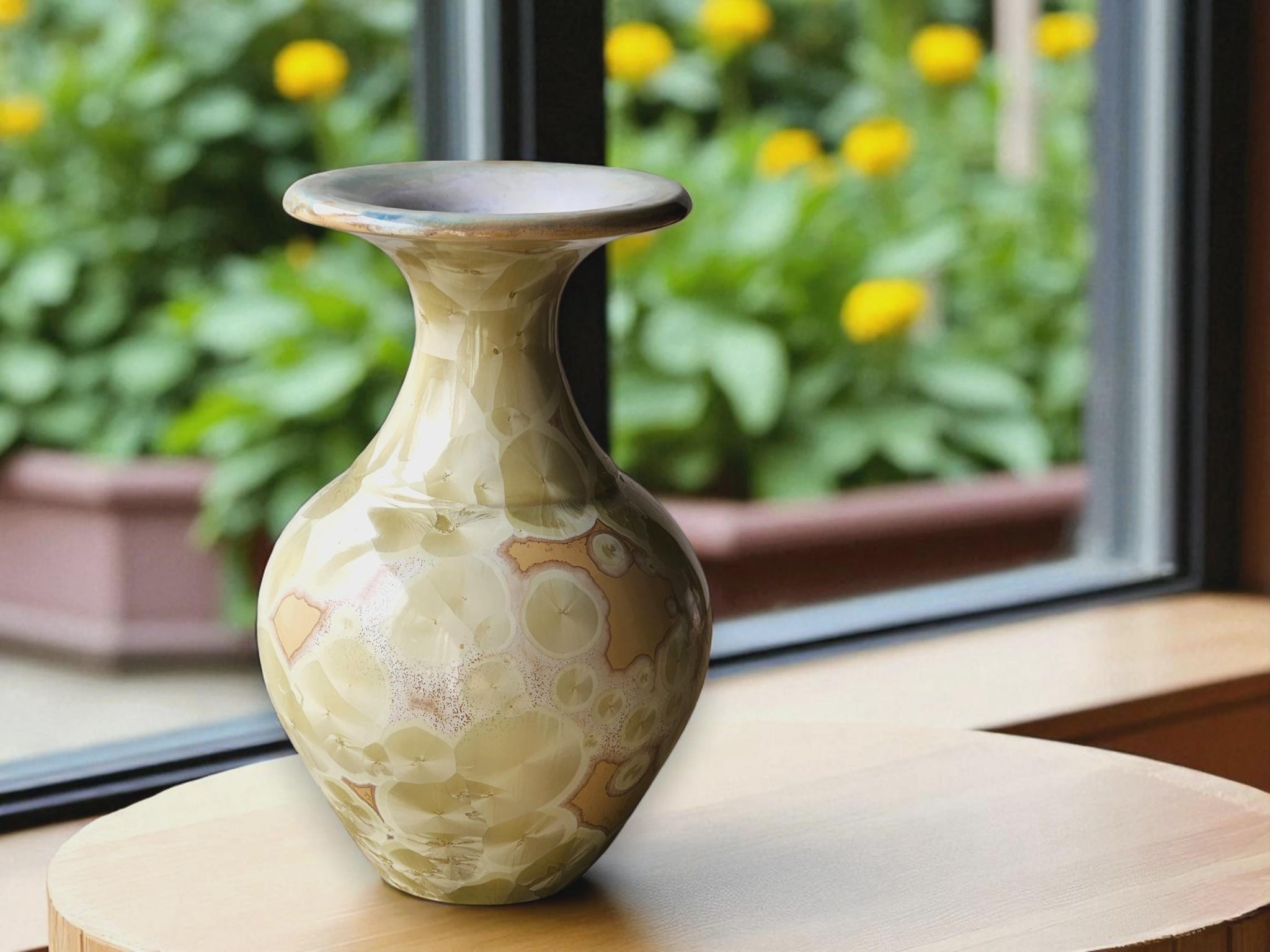 Handmade ceramic vase with cream crystalline glaze