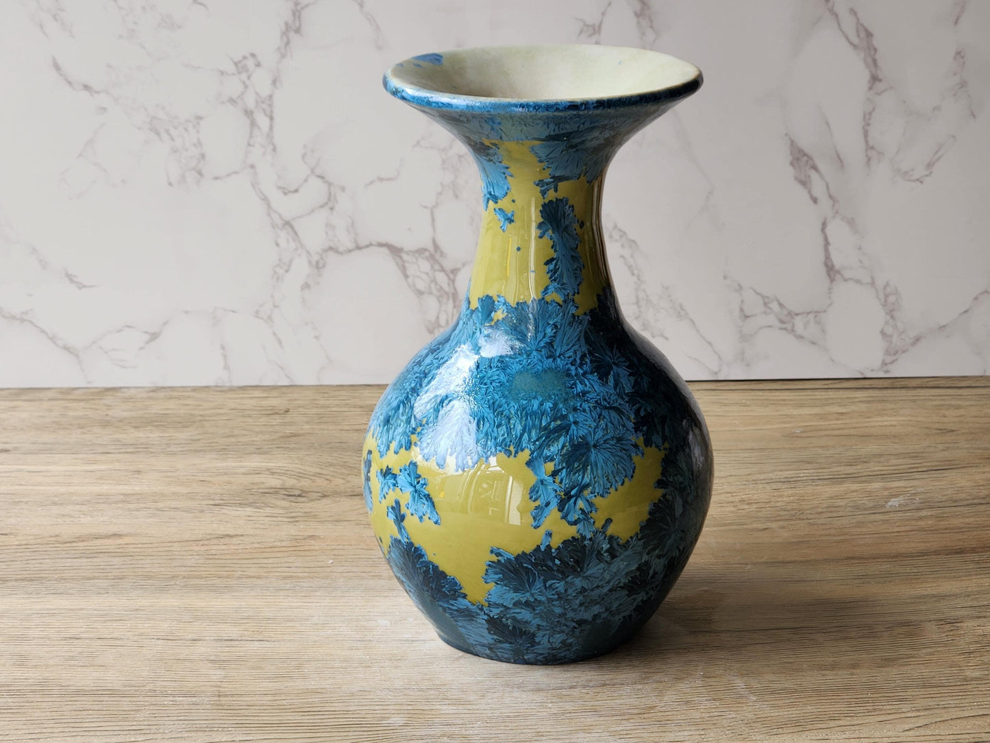 Decorative porcelain vase with feathery blue crystal formations