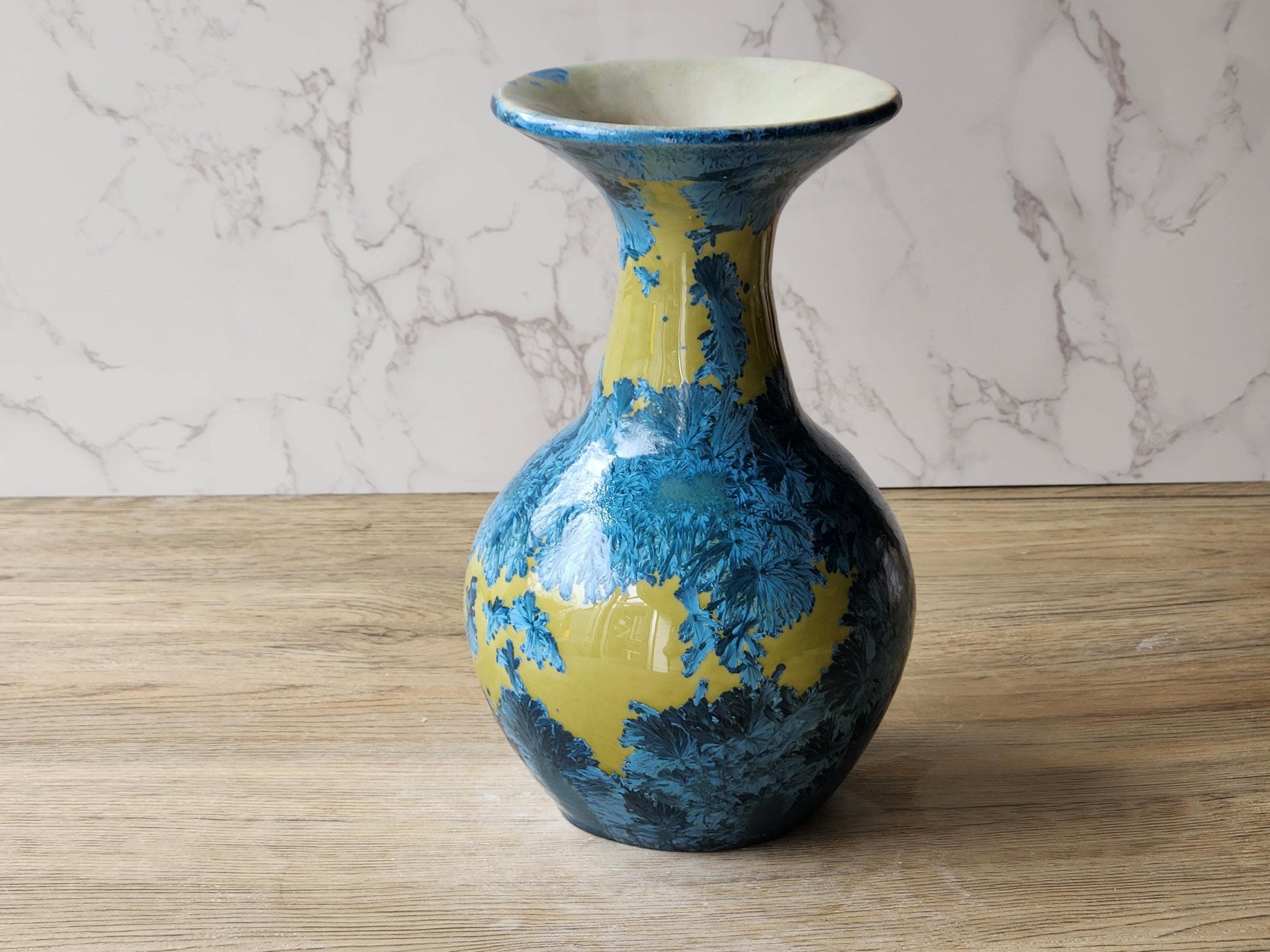 Decorative porcelain vase with feathery blue crystal formations