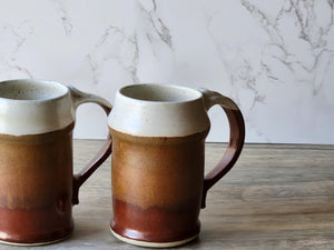 Australian-made beer mug with speckled cream pour over red stoneware