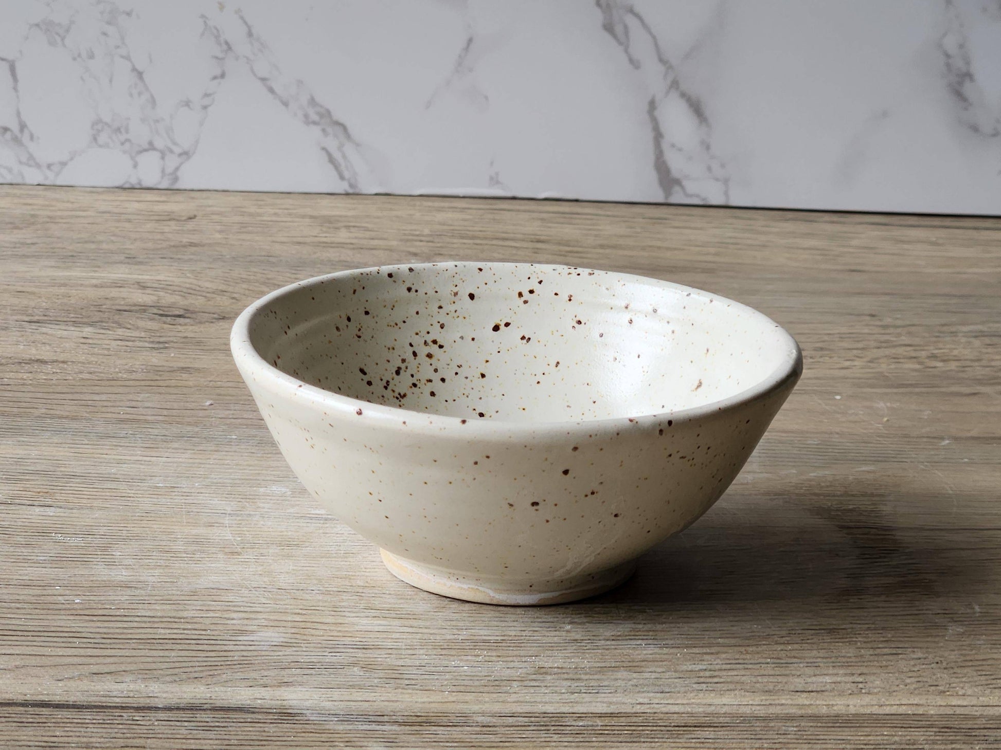 Small dish for salt or sauce in speckled cream glaze from Buxton Pottery