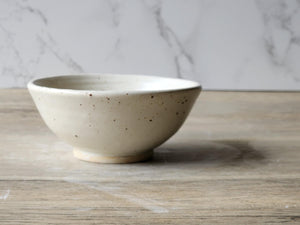 SIde view of  cream speckled sauce dish a great gift idea
