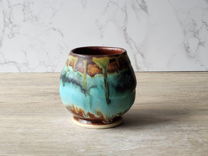 Artisan stoneware yunomi with turquoise drip glaze made in Melbourne, Australia