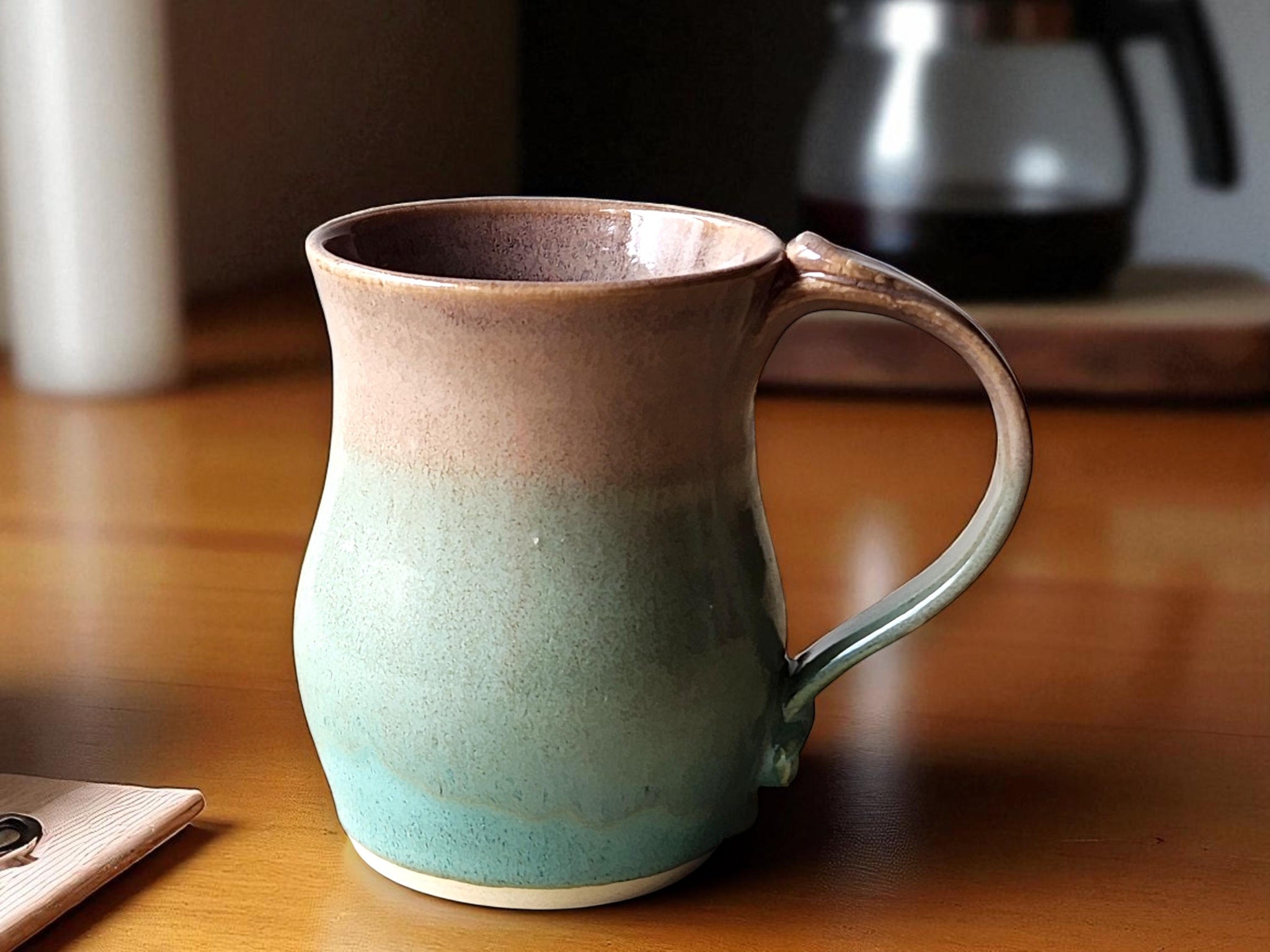 Large handmade pottery mug with oatmeal brown and spearmint green glaze