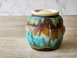 Yunomi tipped upside down showing the rustic woodfired look of the glazes.