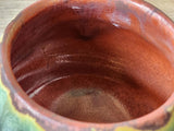 Inside look at the burgundy glazes of the handmade pottery teacup