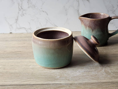 Rustic stoneware jar with speckled brown and green glaze