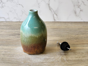Handmade pottery oil dispenser – keeps oil fresh