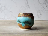 Artisan yunomi teacup with aqua brown finish