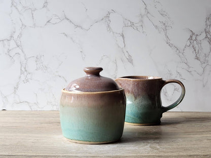 Stoneware pottery jar in soft brown with spearmint green accent