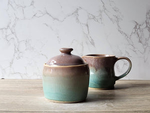 Stoneware pottery jar in soft brown with spearmint green accent