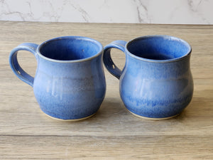 Handmade ceramic tea mug with coastal-inspired blue glaze