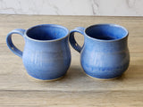Handmade ceramic tea mug with coastal-inspired blue glaze