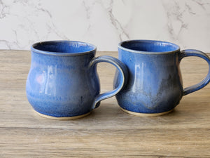 Food-safe ceramic coffee cup with soft blue mottling