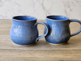 Food-safe ceramic coffee cup with soft blue mottling
