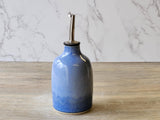 Rustic pottery olive oil pourer with ergonomic design