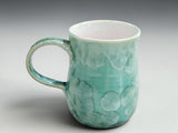 Studio image of handcrafted crystalline glazed coffee mug