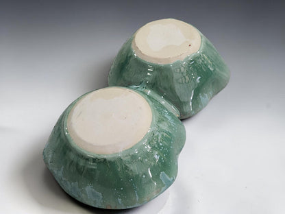 Handmade stoneware snack bowl with dual sections, ideal for entertaining and serving a variety of savoury snacks and condiments.