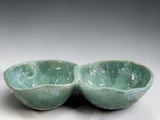 Mottled green ceramic divided bowl handcrafted in Melbourne, showcasing unique glaze movement and artisan craftsmanship.