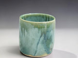 Handmade stoneware tumbler in soft green and aqua glaze, wheel-thrown by Buxton Pottery in Melbourne Australia