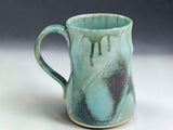 Bush Creek Collection handmade ceramic mug with layered aqua green and earthy glaze variations