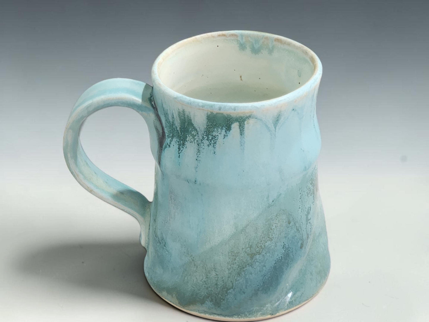 One-of-a-kind Bush Creek Mist pottery mug with calming coastal-inspired colours