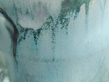 Close-up of flowing misty blue and eucalyptus green glaze on Australian handmade pottery mug