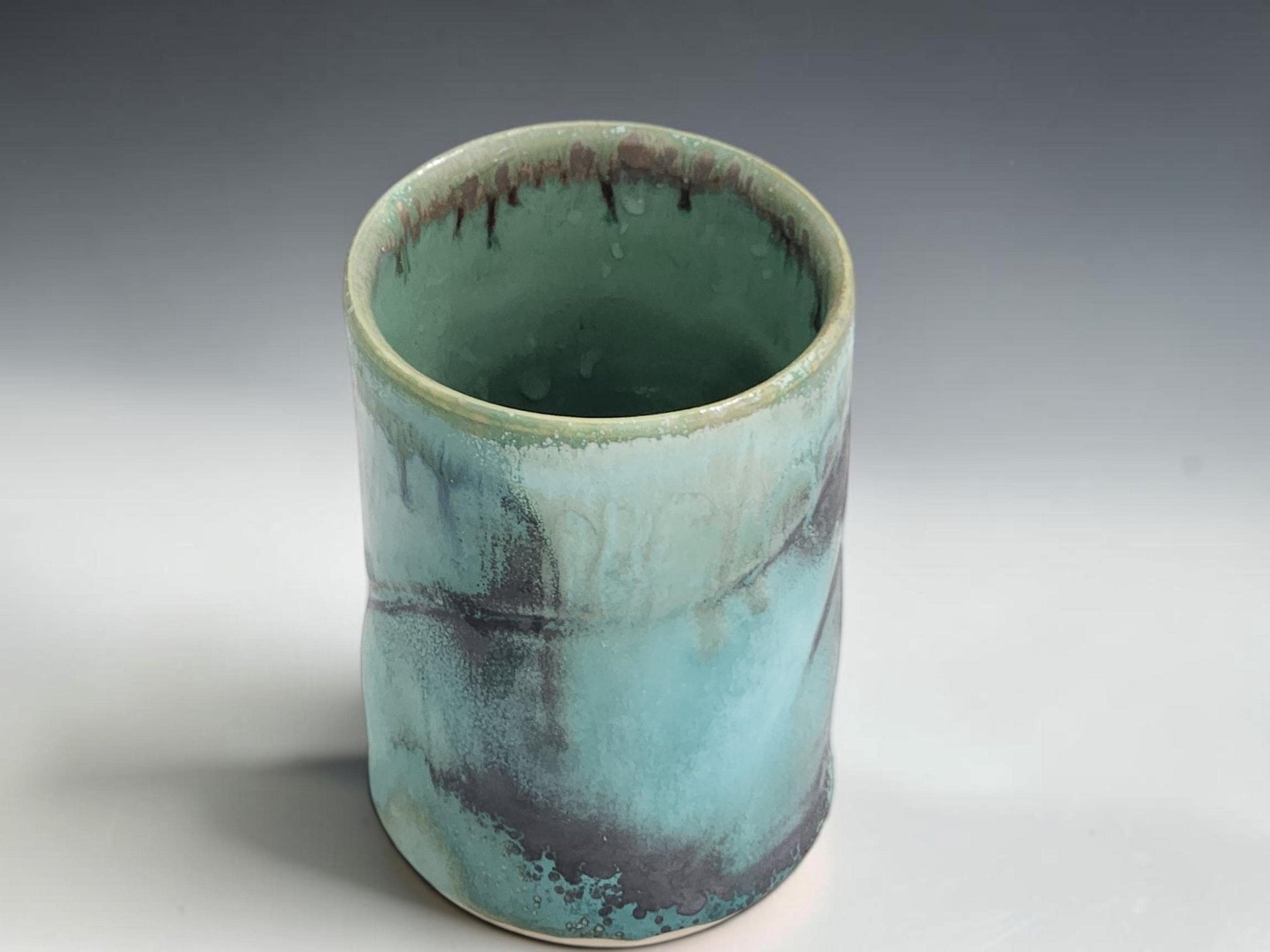 Australian handmade ceramic tumbler with glossy turquoise glaze and natural handmade variation