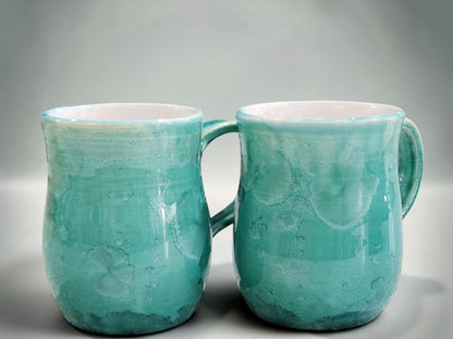 Handmade 350 ml porcelain coffee mug with green crystalline glaze