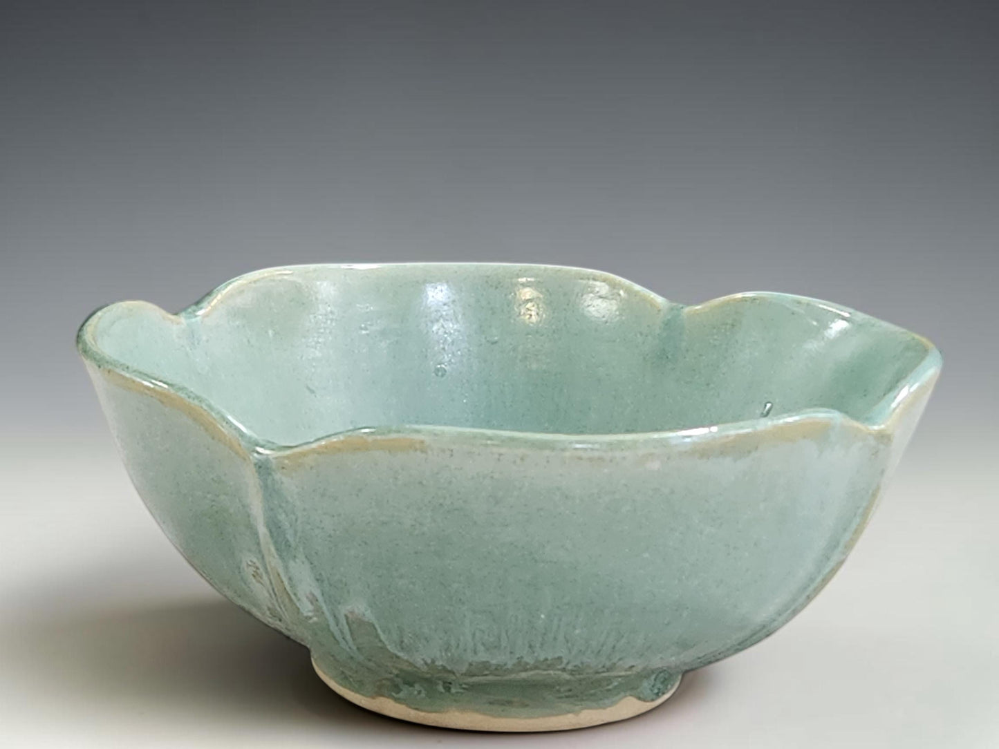 Handmade altered ceramic bowl in seafoam green glaze, crafted by Buxton Pottery in Melbourne Australia