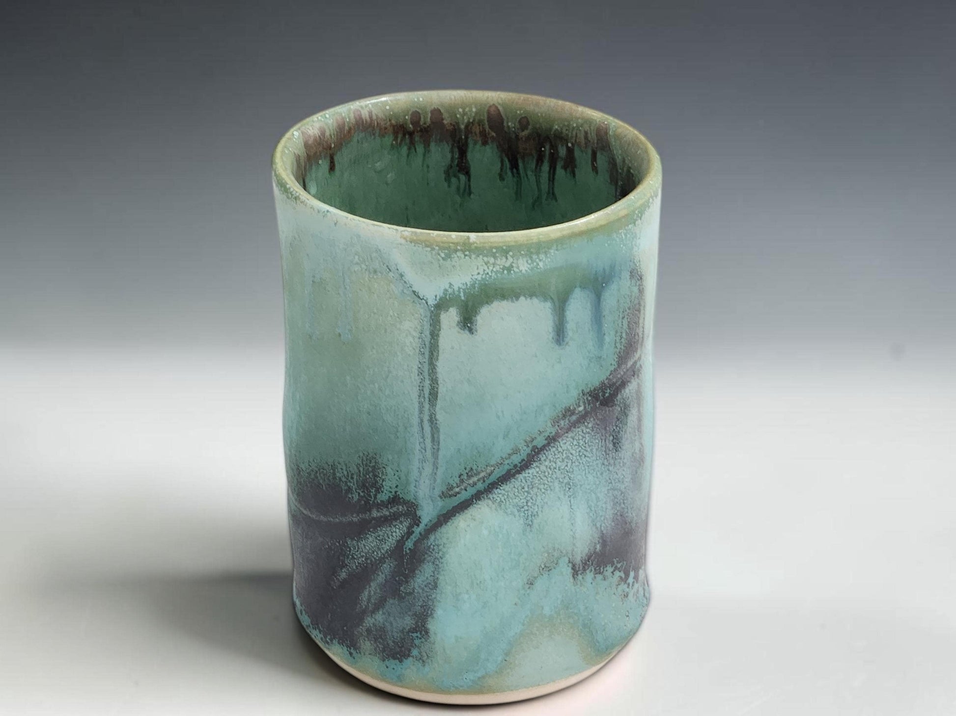 Handmade ceramic tumbler in soft turquoise green glaze, crafted by Buxton Pottery in Melbourne Australia