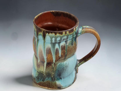 Wheel-thrown ceramic coffee mug with comfortable handle and one-of-a-kind handmade glaze