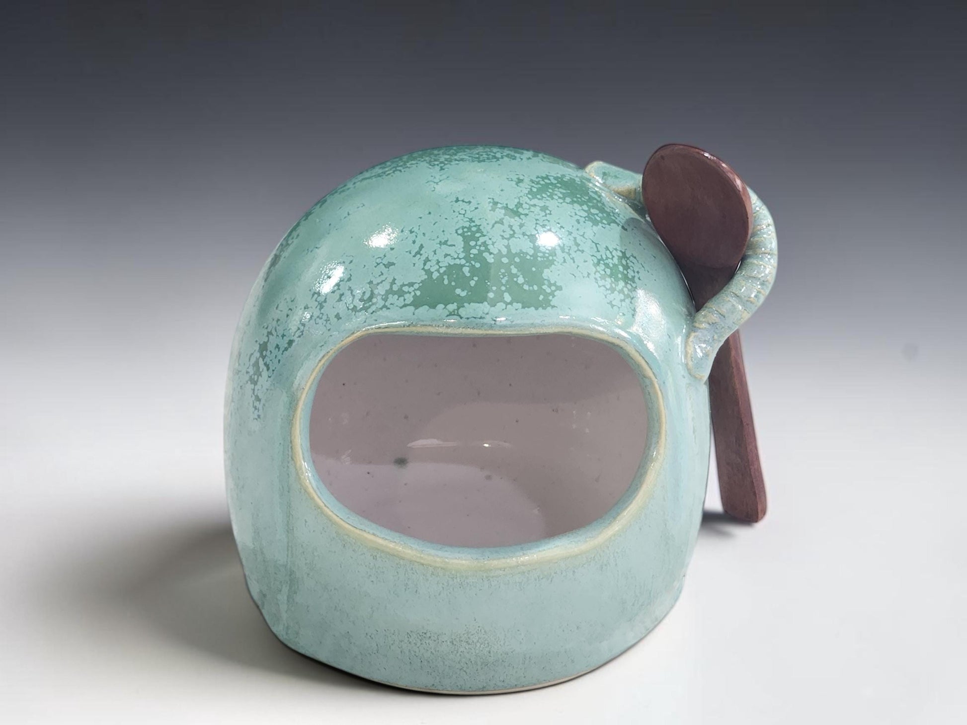 Front view of handmade green stoneware salt pig with wide opening