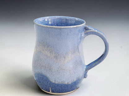 Large blue pottery mug with comfortable handle for tea, coffee or hot chocolate